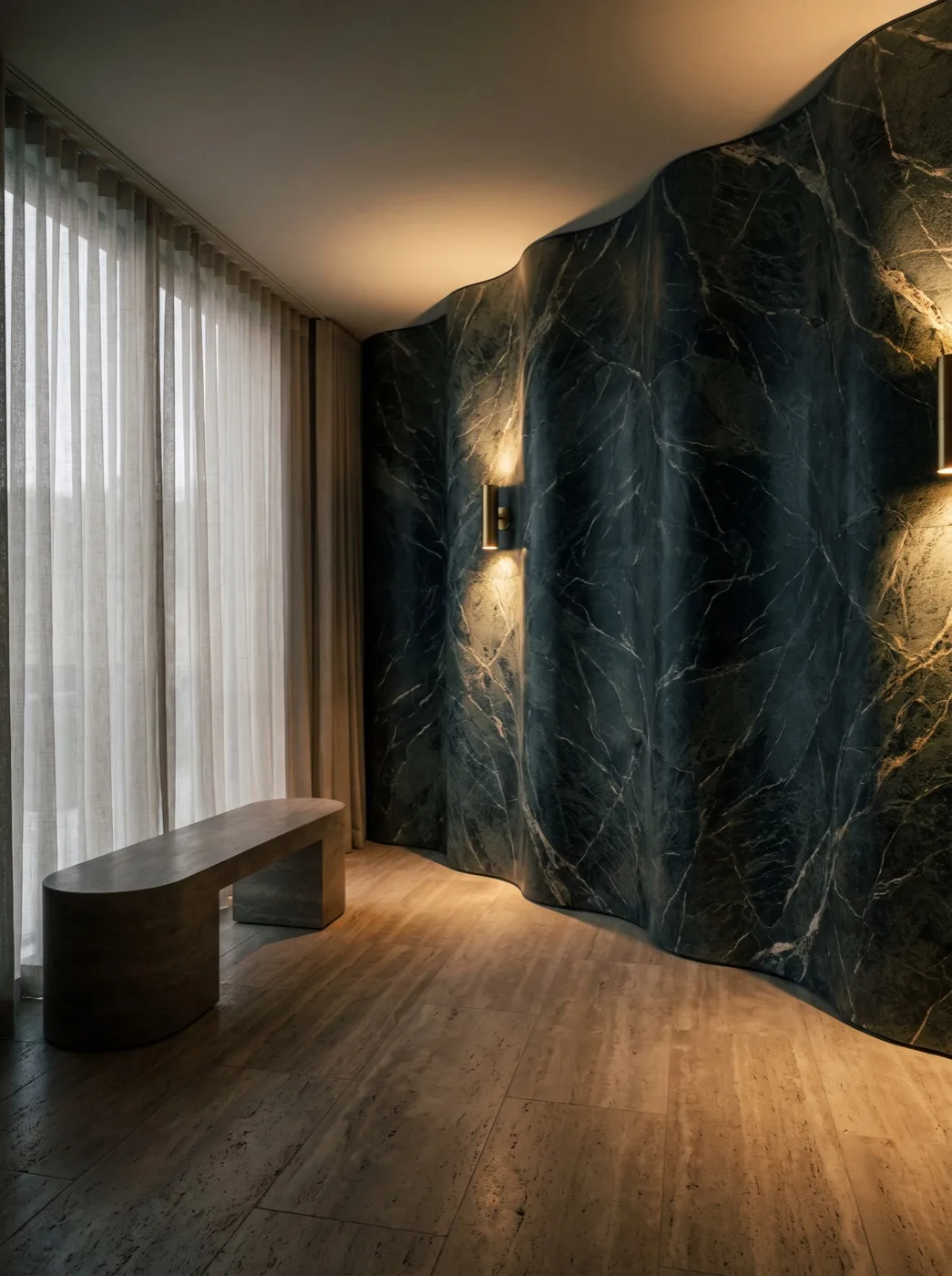 Forest-green marble feature wall in the studio, a nod to the onyx stone